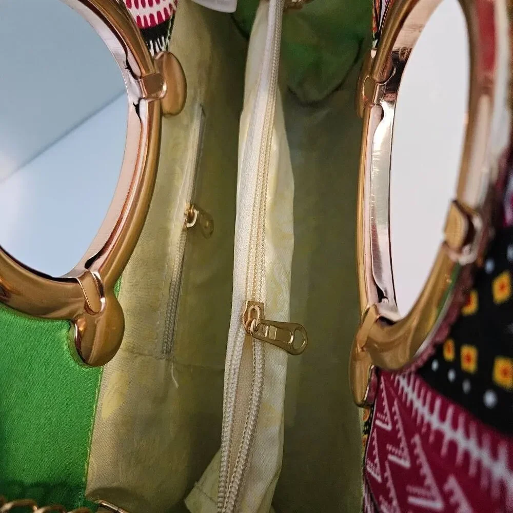 P.K Garments bright green and pink bag with gold hardware.